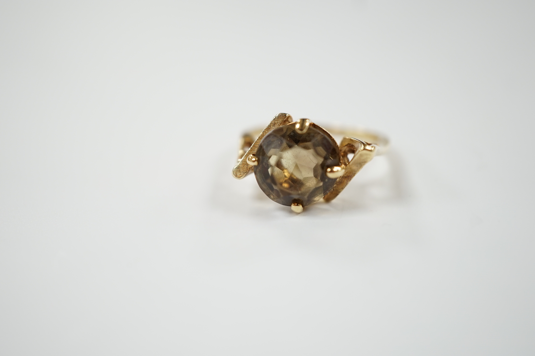 A 14k yellow metal and single stone citrine set dress ring, size N/O, gross weight 3.9 grams.